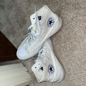 All white high top chuck taylors